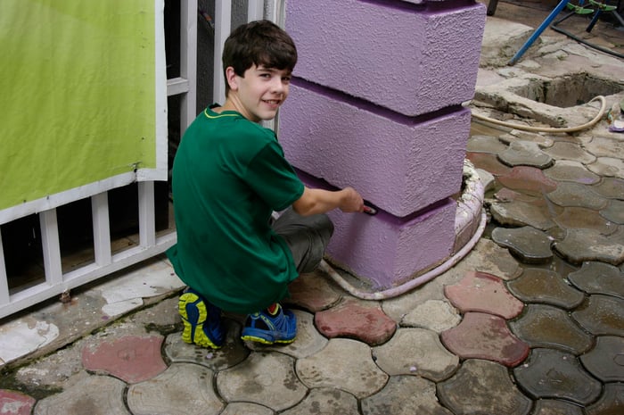 SLS_DanielClavelliPaintingOrphanageinAfrica